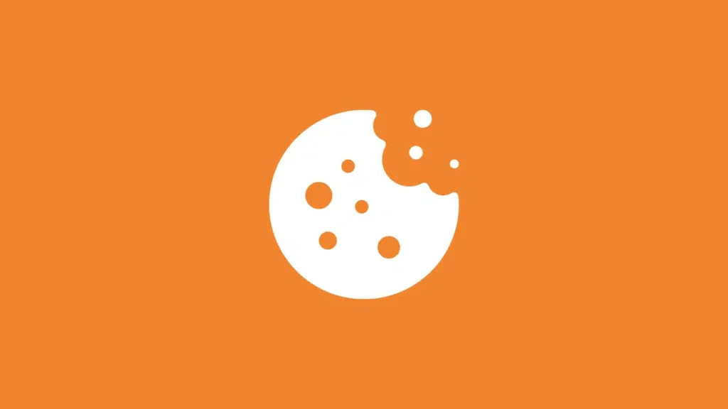 A stylized white cookie with bite marks and scattered crumbs, set against an orange background, cleverly hints at the future of cookies in digital marketing.