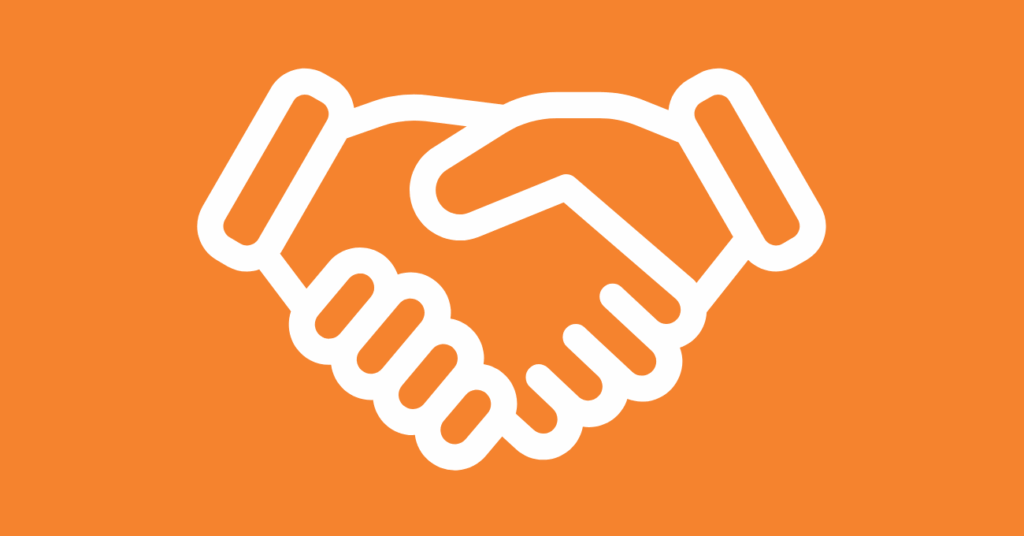 White outline of two hands shaking in a handshake on an orange background, symbolizing agreement, partnership, or cooperation—perfect for illustrating collaboration in white label SaaS or effective retargeting strategies.